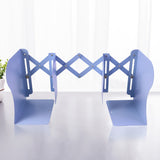 Heavy-duty metal book holder with scissor mechanism in study setting