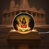 Soft warm glow of Lord Shiva LED night light illuminating bedroom corner