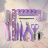 Stainless steel manicure and pedicure tools arranged neatly in the grooming set