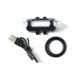Multipurpose LED bicycle safety light attached easily, demonstrating versatile mounting.