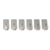 Wall hooks hanging keys and towels in home setting