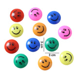 Bright smiley face button magnets on metal surface