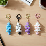 Cute decorative keychain charm showcasing a charming cloud and bell design.