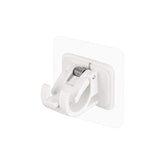 Wall-mounted adhesive towel holder showing towel rod and hooks