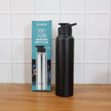 Black stainless steel sports water bottle held during outdoor activity
