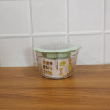 Lifestyle image of manual vegetable grater used in preparing healthy meal