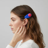 Multiple decorative snap hair clips displayed as a set