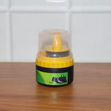 Black shoe polish cream and sponge applicator ready for use