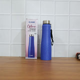 Blue stainless steel water bottle in outdoor fitness setting